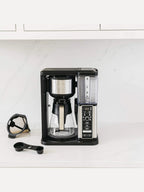 Ninja CM401 Specialty 10-Cup Coffee Maker with 4 Brew Styles for Ground Coffee, Built-in Water Reservoir, Fold-Away Frother & Glass Carafe, Black